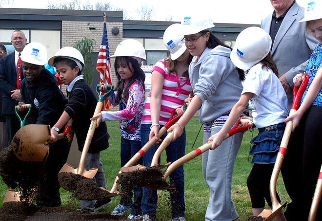 Hats tip forward on a few of the General Herkimer fifth-grade students as they dig with shovels during a ground breaking ceremony Tuesday April 13, 2010. The students (left) Myles Felton, 11, Noah Tran, Nadiya Tran, 10, Alison Owen, 11, Adriana Collado, 12 and Samantha Gabiger, 10 along with other students participated in the event.
