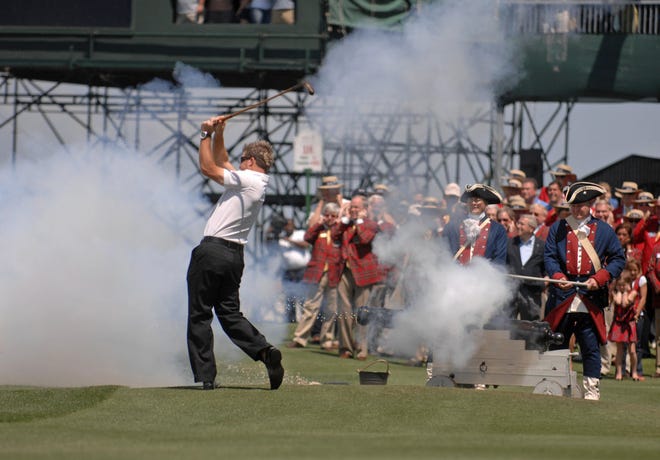 Verizon Heritage 2009 winner Brian Gay hits a ball from the 18th green into Calibogue Sound as a Colonial era cannon is fired during the annual opening ceremony at Harbour Town. (John Carrington/Savannah Morning News)