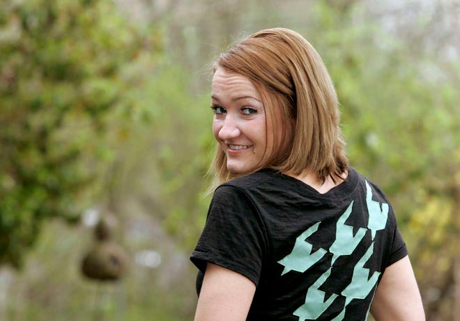 Rockford designer Alexis Peabody wears a shirt from her clothing line, Lexy Charms Couture.