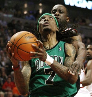 Boston Celtics guard Marquis Daniels eyes the basket as Chicago Bulls guard Ronald Murray defends during the first half of an NBA basketball game Tuesday, April 13, 2010, in Chicago.