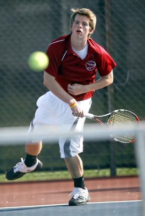 Seaman's Steven Fletcher serves the ball Wednesday to Highland Park's Marcus Williams in a semifinals match during the Seaman High School Tennis Invitational.