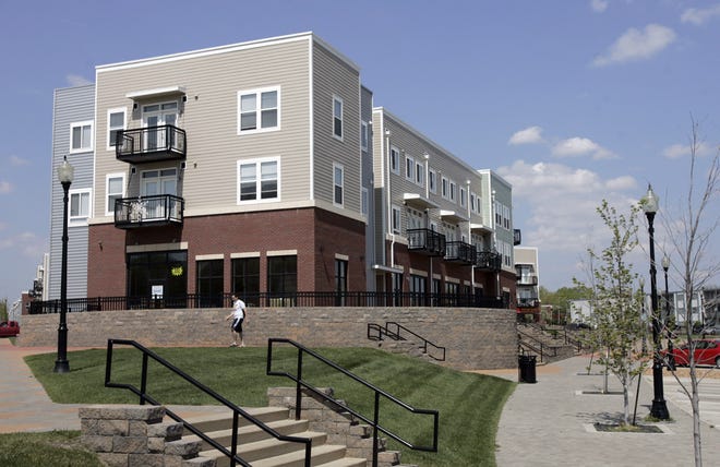 The 25 townhomes and 24,000 square feet of retail space stand empty in a $30 million development in central Topeka's College Hill business district, making it difficult to raise sales tax revenue to help pay off the bonds used to finance the project that developed the area.