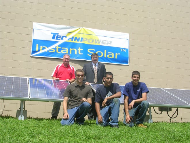 Blackstone Valley Regional Vocational Technical High School students and several staff members were involved in the development of an instant-mounting solar panel system last summer with Technipower Systems Inc. Pictured, front row, from left, are Ethan Desilets of Bellingham, Kaviraj Siegel of Milford, and Matthew Squadrito of Milford; back row, Valley Tech instructor David Lewis and Dan Connors of Technipower.