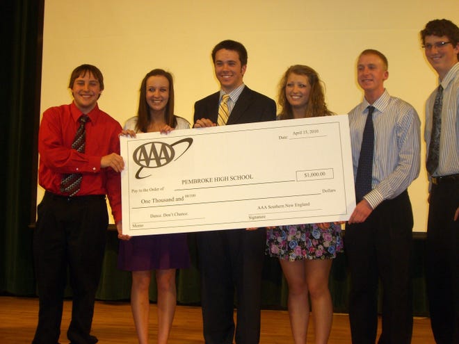 The cast of the winning video in the “Dance, Don’t Chance” contest holds a $1,000 prize check from AAA. From left are Tom Warren, Brittany Baillie, Tim Lewis, Taylor Cahill, Matt Rineini and Tim Cahill.