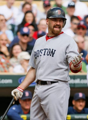 Boston's Kevin Youkilis disagrees after he is called out on strikes during the Red Sox' 8-0 loss to the Minnesota Twins on Thursday.