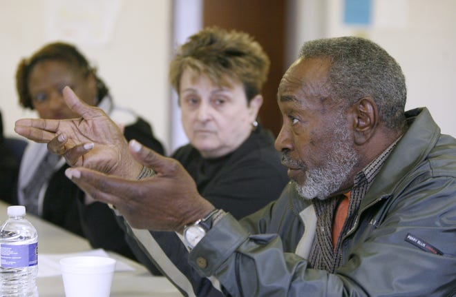 The Rev. Jim Ruffin of Canaanland Church of God speaks during a brainstorming session at Saturday’s Ceasefire conference at River of Life Christian Fellowship, which was hosted by the Community Coalition Against Violence. Sheryl Glover (left) and the Rev. Louanne Zakaski listen to his views.