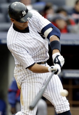 New York's Alex Rodriguez hits a home run Saturday during the fourth inning of the Yankees' 7-3 victory over the Rangers. It was Rodriguez's 584th career home run and first this season, passing Mark McGwire for sole possession of eighth place on the career list.