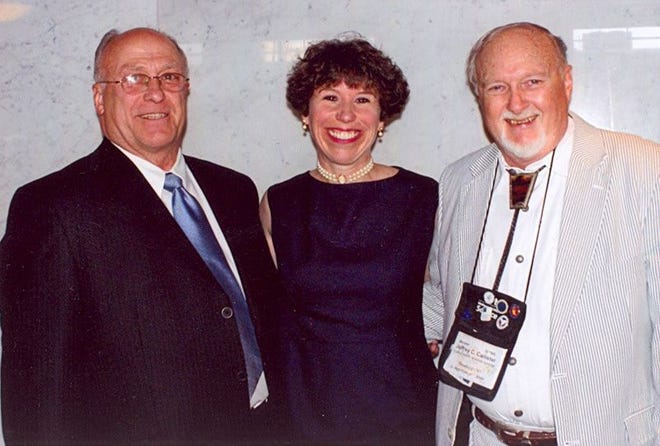 Award-winning Heather Hill McArdle is pictured with her father, Paul E. Hill, and her former high school science teacher, Jeff Callister, during the National Science Teachers Association Convention in Philadelphia.