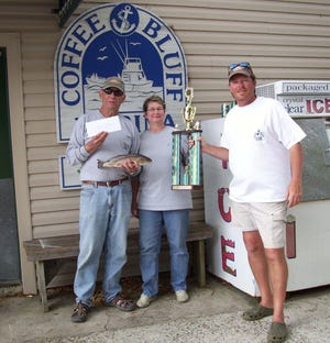 Coffee Bluff resident David Sloan(Left) and daughter Becky Hancock were the first place winners in the first annual His and Her Tournament held out of Coffee Bluff Marina this past Saturday. The two weighed in five red drum totaling nine pounds, eight ounces. Presenting them with their trophy is Capt. Ray Golden who operates the Coffee Bluff facility. (Special to the Savannah Morning News.)