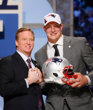 Arizona tight end Rob Gronkowski is welcomed to the NFL and the New England Patriots by commissioner Roger Goodell after he was selected as the 42nd overall draft pick Friday.