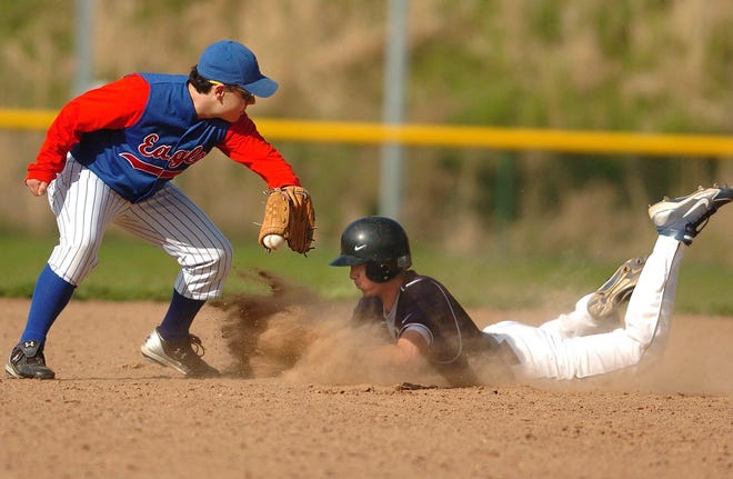 Norwich Tech's Mike McKeon, right, slides safely onto second, just ahead of Ellis Tech's Troy Bissonnette, left, with the ball during a baseball game at Norwich Technical High School Friday, April 23, 2010.
Tali Greener/ NorwichBulletin.com