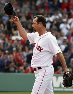 Red Sox pitcher Tim Wakefield tips his cap after being removed from yesterday's game during the seventh inning. Boston led 4-1 at the time, but lost 7-6 in 10 innings.