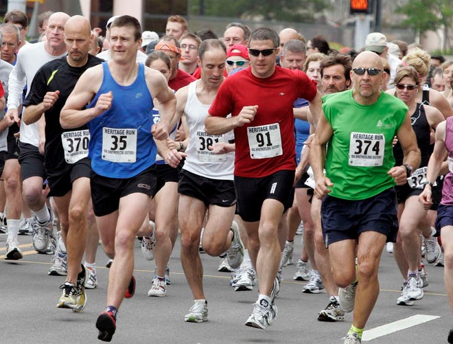 Runners start the 26th annual Heritage Run on Sunday, April 25, 2010, on Wyman Street in Rockford.