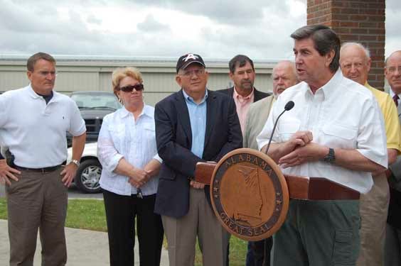Gov. Bob Riley speaks to the media Monday at Albertville Regional Airport after surveying the tornado damage in Albertville. (KERRY YENCER | SPECIAL TO THE TIMES)