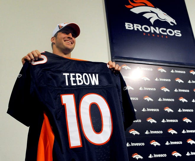 Tim Tebow is introduced to the news media at Dove Valley, Colo., after his selection by the Denver Broncos as the 25th pick in the NFL draft. The jersey number 10 is for the 2010 draft. Tebow will wear number 15 for the Broncos.