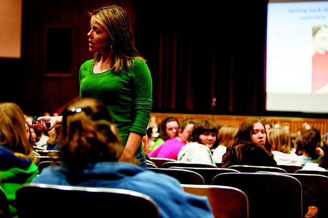 Meghan McCoy, of Massachusetts Agression Reduction Center, speaks to girls about cyberbullying earlier this month at the John W. Rogers Middle School in Rockland.