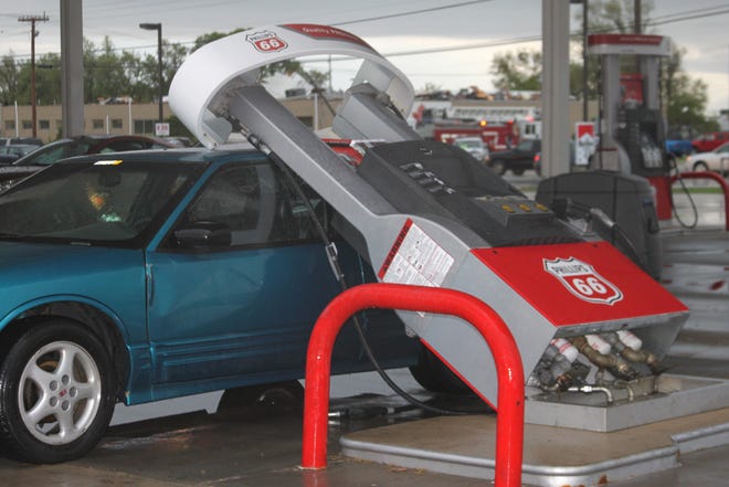 A gas pump was blown onto this car at the Becks gas station.