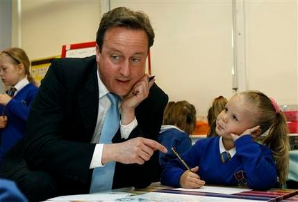 Britain's opposition Conservative Party leader, David Cameron, talks to children at the Western Springs Community primary school in Rugeley, central England, Friday, April 30, 2010. Cameron gained momentum Friday as a new poll declared him the winner of the final TV debate, a victory that comes less than a week before Britain's national election. Cameron's strong showing raised Conservative hopes of taking office in the May 6 election after 13 years as the main opposition to Prime Minister Gordon Brown's ruling Labour party.