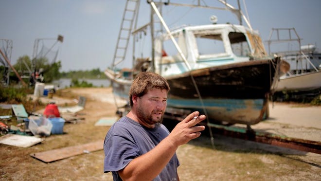 Darby Cheramie, a commercial fisherman in Venice, Louisiana takes a break from working on his family's boat Saturday afternoon. Cheramie and his father, Donald Cheramie, who fish the Gulf of Mexico together, are among the large population of commercial fisherman in Louisiana that are no longer able to make a living because of a growing oil spill in the gulf.