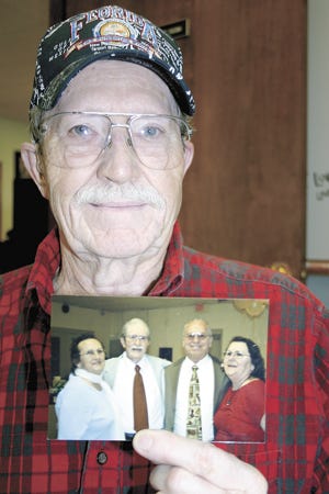 Richard (Dick) Nichols of Colon holds a photo showing him with his newly found half-siblings, Barbara,
