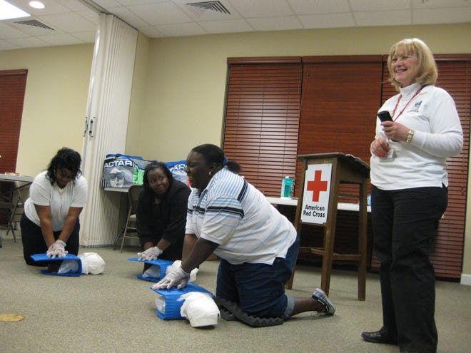 Red Cross safety trainer Lyn Schumacher, right, leads a four-hour CPR course at the agency's headquarters off Chatham Parkway. The agency will begin offering hour-long courses for people interested in CPR training but not required by their jobs to take it.