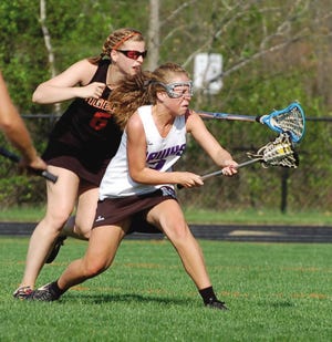 Marshwood's Jillian Gori, right, is tightly defended by Biddeford's Autumn
Linteau during Tuesday's Western Maine Class A girls lacrosse match in South
Berwick. Marshwood won, 12-1.