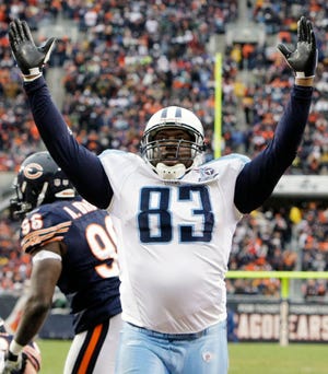 Tennessee Titans tight end Alge Crumpler celebrates the Titans' third touchdown during the fourth quarter of their NFL football game and 21-14 win over the Chicago Bears at Soldier Field in Chicago, Sunday, Nov. 9, 2008. (AP Photo/Charles Rex Arbogast)
