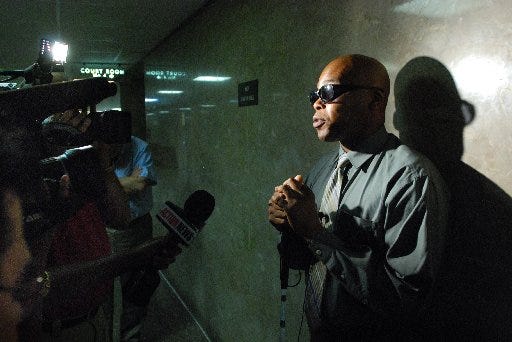 Anthony Blakely answers questions from the media in the hallway at the Duval County Courthouse after Foster Leon was sentenced to 2 life terms for the attempted murder of Blakely. Even though the light was bright in his face, Blakely will always be in the dark. Leon cut out Blakely's eyes when he attacked the DJ after he left a Five Points club on July 4, 2008.
