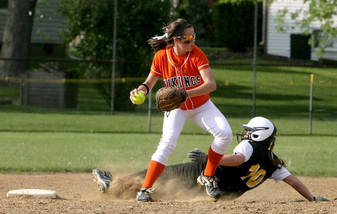 Hoover's Mackenzie DiPetro prepares to throw to first to complete a double play as Perry's Abby Filliez slides into second during Friday's Federal League game.