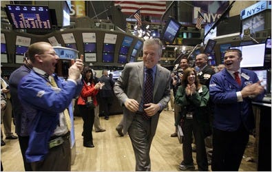 Traders applauding Duncan L. Niederauer, chief of NYSE Euronext, on Friday. He had defended his exchange in an interview.