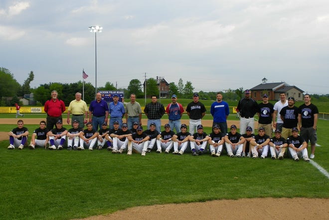 Members of the Jackson High School baseball team pose with former Polar Bears during Alumni Night on Friday. Former players were introduced between doubleheader games against Kent Roosevelt.