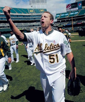 Oakland pitcher Dallas Braden exhorts the fans after throwing a perfect game against Tampa Bay on Sunday in Oakland, Calif.