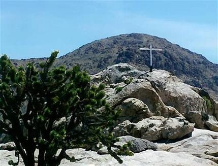 This undated photo taken by Henry and Wanda Sandoz and made available Wednesday, Oct. 7, 2009, by the Liberty Legal Institute shows the memorial known as the "Mojave Cross", on an outcrop known as Sunrise Rock in the Mojave National Preserve, in Calif.