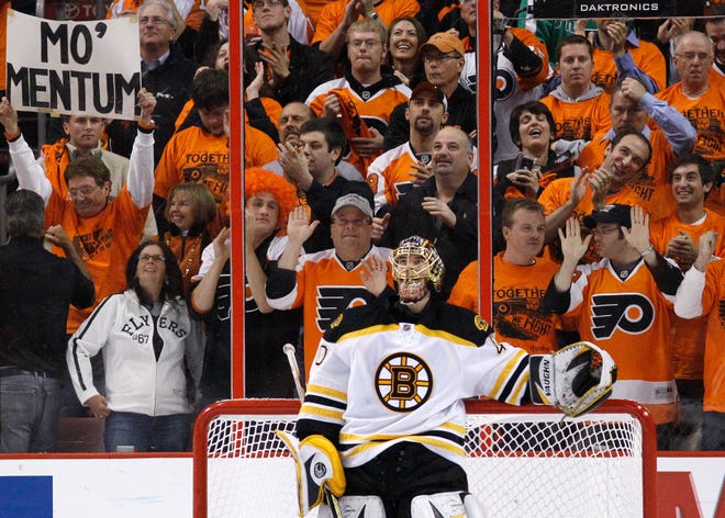 Philadelphia Flyers fans cheer after Boston Bruins' Tuukka Rask, of Finland, gave up a goal in the first period of Game 6 of a second-round NHL playoff hockey series, Wednesday, May 12, 2010, in Philadelphia. (AP Photo/Matt Slocum)