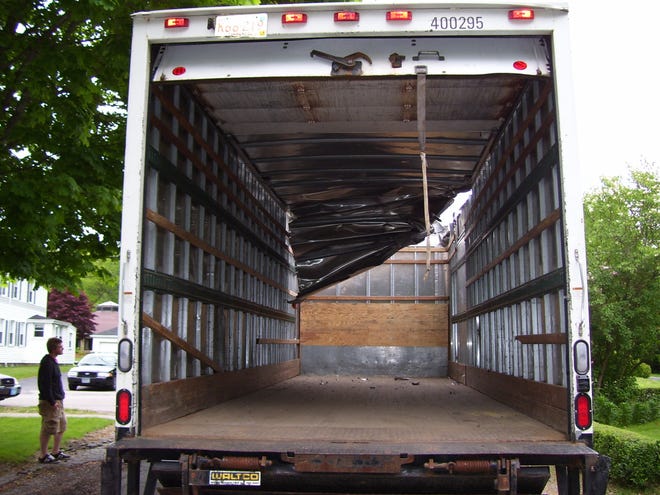 This Ryder rental truck, driven by Keith Herron 26 of 19 Dutcher Street, Hopedale, hit the railroad bridge on Hopedale Street in Hopedale yesterday at 4:32 p.m. Police said the truck was 28 feet tall, about two feet taller than the bridge. The truck, owned by Ryder Truck Rentals out of Braintree, sustained substantial damage to the top and was towed away. No injuries were reported. Police said it appeared the bridge only sustained minor scratches. First Colony Development Co. of Marlborough was notified to have the bridge checked out. Herron was cited for failure to obey traffic signs.