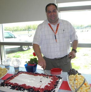 Tom Baldino, the industrial arts teacher at Oliver Ames High School, is being deployed with the Army National Guard for the second time to the Middle East. A farewell party was held for him last week.