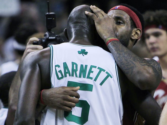 Celtics forward Kevin Garnett and Cavaliers forward LeBron James hug after Boston knocked Cleveland from the playoffs with a 94-85 win.