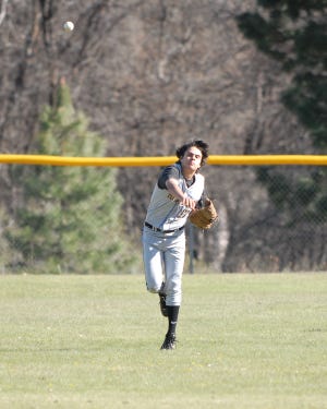 Andrew Campbell throws after catching a fly ball during a scrimmage at Mount Shasta May 11, 2010.