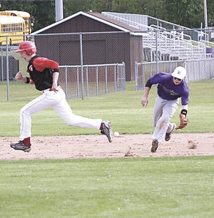 Three Rivers shortstop Dan Shutes fields a groundball in the first game of the Wildcats’ split with Paw Paw.