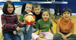 Submitted Photo Valley Road Elementary School first-graders sit with the Van Gogh puppet created by Lenape Valley High School art students.