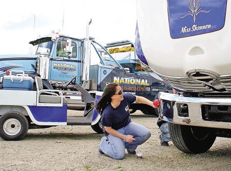 Tara DeWolfe, of Northborough, Mass., polishes “Miss Shannon,” for the tow truck beauty contest Saturday at Hampton Beach State Park during the Tow Truck Rodeo, which continues today.