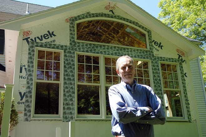 Brian Sheehan outside his unfinished sun room at his Easton home. Sheehan’s home improvement project was abandoned by a Lakeville contractor facing financial difficulties.