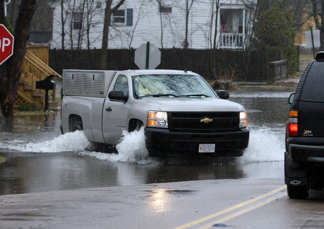A truck passes through a large puddle on Belmont Avenue in Brockton while the road was flooded earlier this month. This could be a common scene in the flood-prone section of the city if forecasters’ predictions of 3 to 6 inches of rain are correct.