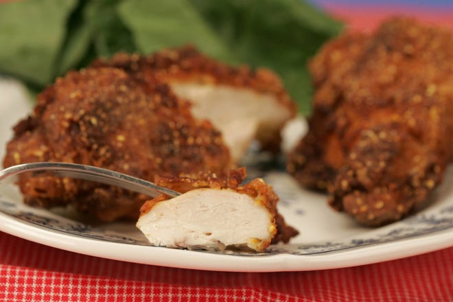 Cornmeal gives a little extra crunch to fried chicken. (Glenn Koenig/Los Angeles Times/MCT)