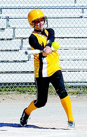 Pellston's Shelby Hughey rips a run-scoring double in Pellston's first of two wins over Jo-Burg on Tuesday.