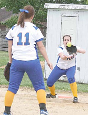 Galva first baseman Meg Engstrom awaits a throw from pitcher Taylor Williams for a putout against Orion Tuesday.
