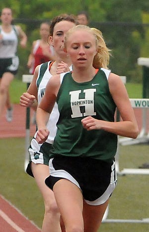 Hopkinton's Kellie Lodge holds off Westwood's Rachael Keating to win the mile at the Tri-Valley League meet yesterday.