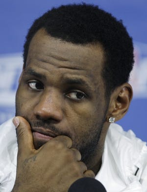 This May 13, 2010, file photo shows Cleveland Cavaliers forward LeBron James listening to a question during a news conference in Boston.