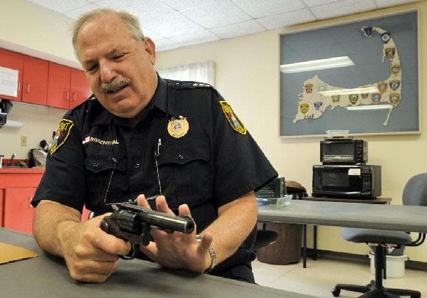 Wellfleet Police Chief Richard Rosenthal, holding a .38 Special, talks about gun safety. The former New York officer plans to retire this summer as he nears his 65th birthday.