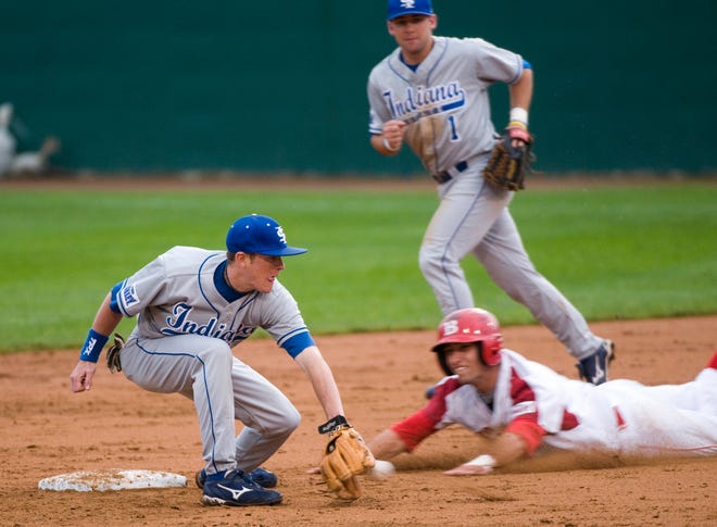 Bradley's Rob Elliott slides safely into second base between Indiana State's Ben Ferrell, left, and Grant Grgurich on Thursday afternoon at O'Brien Field in Peoria.